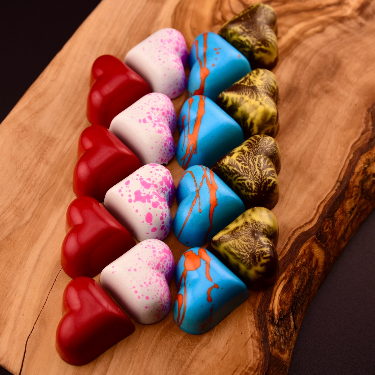 Heart-shaped bonbons decorated in red, pink, blue, and gold